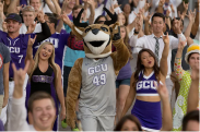 Thunder the GCU mascot cheering with students